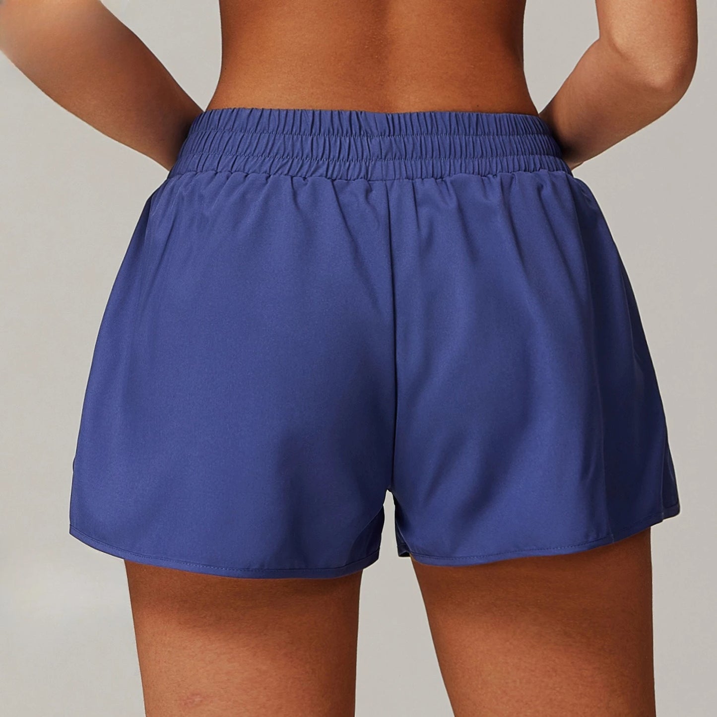 Custom LOGO women's pocket nude quick-drying yoga shorts fake two-piece sports hip-lifting shorts running cycling fitness pants